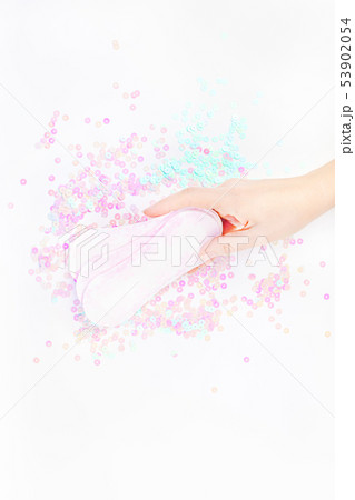 Woman hand holding daily sanitary napkins Woman hand holding daily sanitary napkins 53902054