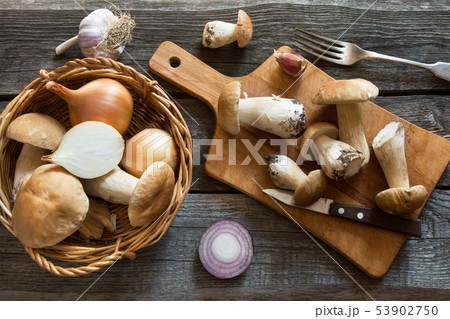 Fresh white mushrooms in basket and ingredients 53902750