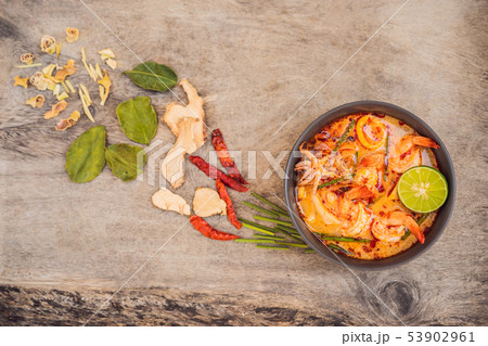 Prawn and lemon grass soup with mushrooms,Tom Yam Kung ,thai food in wooden background, top view 53902961