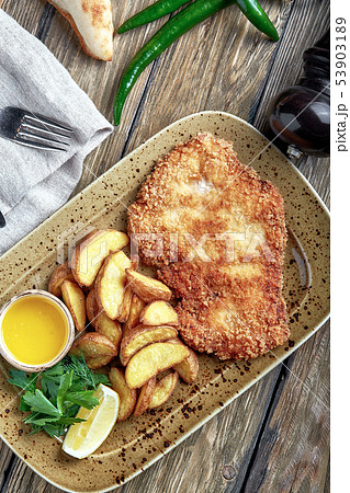 Tasty schnitzel with boiled potato. Top view, flat lay food Tasty schnitzel with boiled potato. Top view, flat lay food 53903189