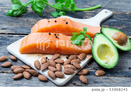 Raw Salmon with Almond and Avocado on a wooden 53908245