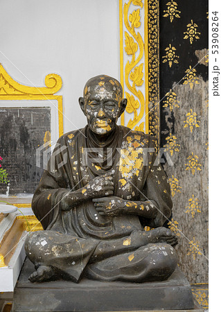 Statue of Sitting Monk Splattered With Paint Statue of Sitting Monk Splattered With Paint 53908264