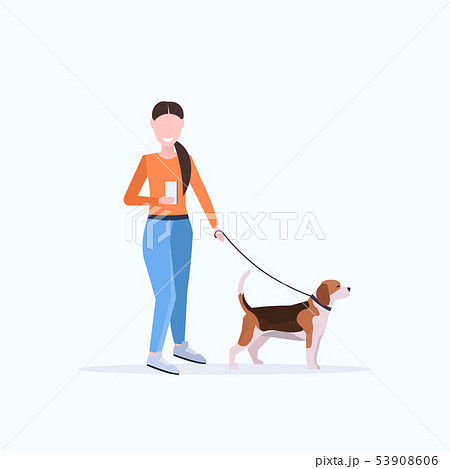 woman walking with dog using smartphone social media network communication digital gadget addiction 53908606