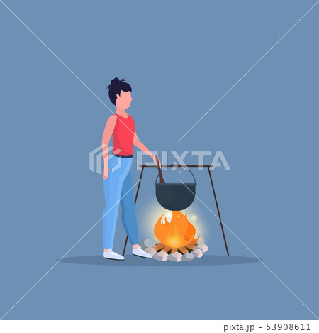 woman hiker cooking meals girl preparing food in bowler boiling pot at campfire hiking camping 53908611