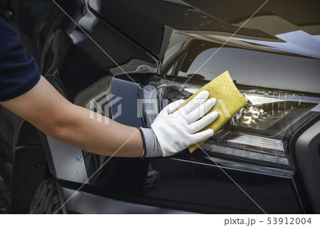 This image is a picture of wiping the car. 53912004