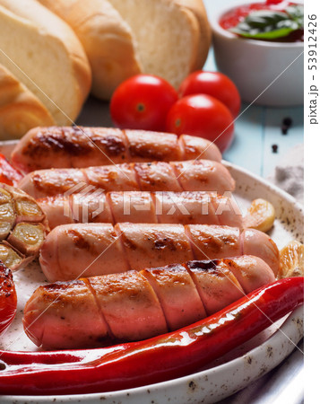 Grilled chicken sausages close up Grilled chicken sausages close up 53912426