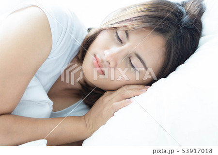 Closeup young woman sleeping with happy face Closeup young woman sleeping with happy face 53917018