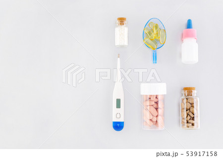 various medical products, natural supplement and thermometer flat lay with copy space various medical products, natural supplement and thermometer flat lay with copy space 53917158