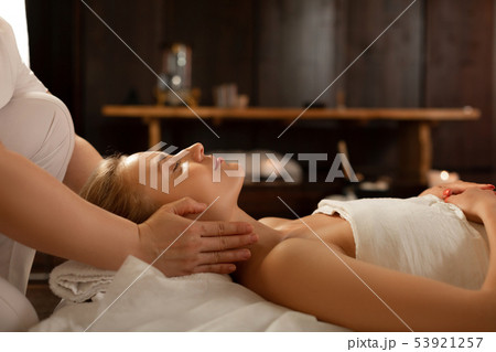 Young beautiful woman with closed eyes being in calm atmosphere Young beautiful woman with closed eyes being in calm atmosphere 53921257