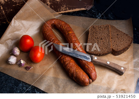 Smoked sausage with rye black bread on the Smoked sausage with rye black bread on the 53921450