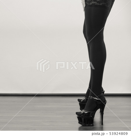Sexy long female legs in black. 53924809