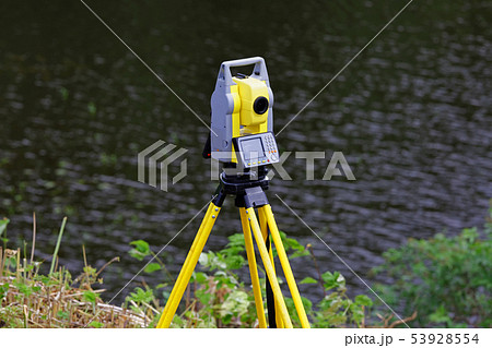 The total station is installed on a tripod 53928554