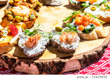 Sandwiches with different filling on wooden board Sandwiches with different filling on wooden board 53929050