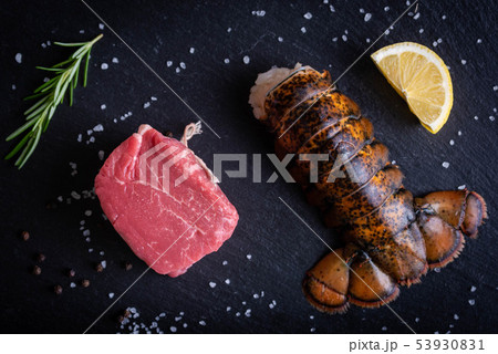 surf and turf, raw fillet mignon and lobster tail 53930831