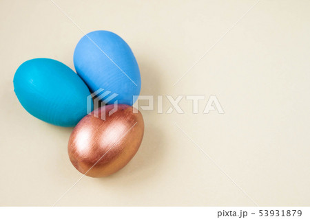 Three colorful easter eggs on light background 53931879