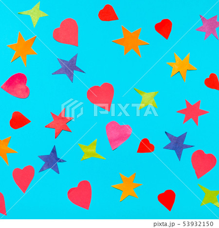 hearts and stars cut from papers on blue paper hearts and stars cut from papers on blue paper 53932150