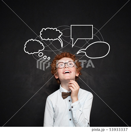 Smart kid boy with empty speech clouds bubbles  53933337