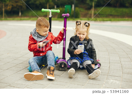 Cute child in a park playing on a grass 53941160