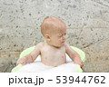 Funny cute bay boy taking a bath outdoor. Funny toddler in a soapy foam. 53944762
