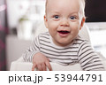 Portrait of Cute adorable baby boy smiling and looking at camera. 53944791