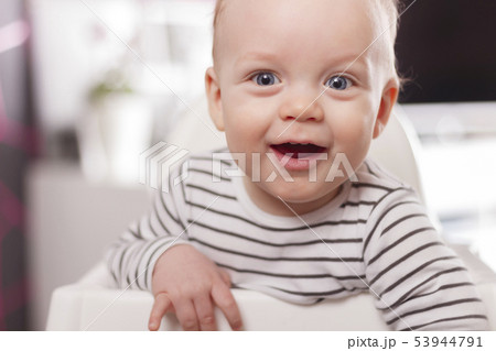 Portrait of Cute adorable baby boy smiling and looking at camera. 53944791