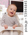 Happy smiling cute toddlersitting in the baby chair. Concept of happiness 53944845