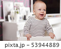Happy smiling cute toddlersitting in the baby chair. Concept of happiness 53944889