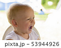 Cute toddler with dirty mouth. Portrait of the child after he has eaten yoghurt 53944926