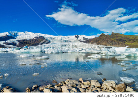 Beautiful blue sky and small iceberg floating  53951490