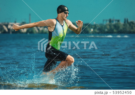 Professional triathlete swimming in river's open water 53952450