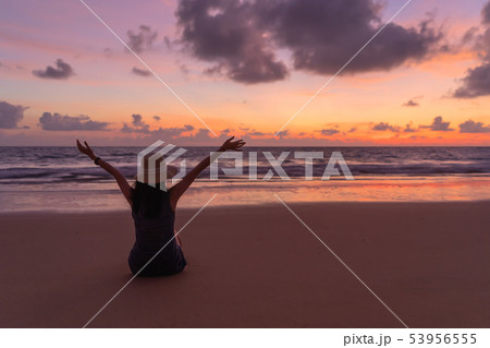 Happy Asian woman relaxing and enjoying at the 53956555