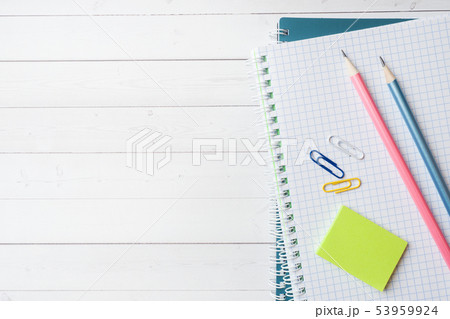 Clean white notebook and pencil with copy space Clean white notebook and pencil with copy space 53959924
