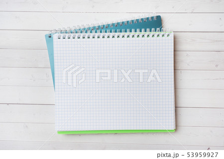 Clean white notebook and pencil with copy space Clean white notebook and pencil with copy space 53959927