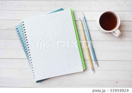 Clean white notebook and pencil with copy space Clean white notebook and pencil with copy space 53959929