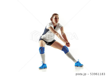 Young female volleyball player isolated on white studio background Young female volleyball player isolated on white studio background 53961183