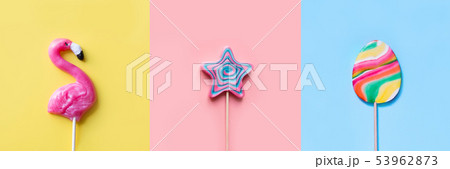 Three colorful lollipops candy on pastel. Funny concept. Top view. Collage. 53962873