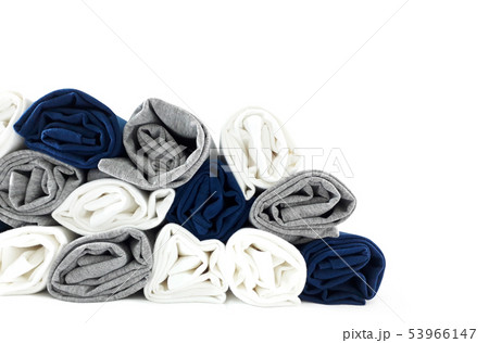 Colours rolled t-shirts di cut on white wallpaper. 53966147