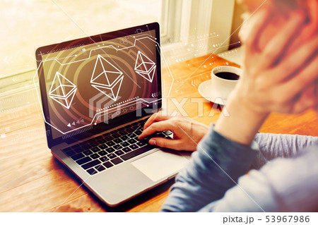 Ethereum with man using a laptop 53967986