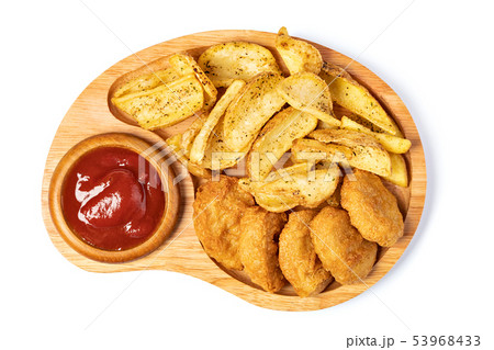 Tasty fried nuggets and potatoes Tasty fried nuggets and potatoes 53968433