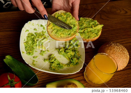 Making avocado toast on the home kitchen Making avocado toast on the home kitchen 53968460