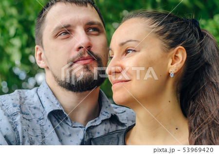 Outdoor portrait of a couple in love Outdoor portrait of a couple in love 53969420