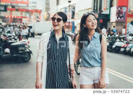 travelers walking on street shopping 53974722
