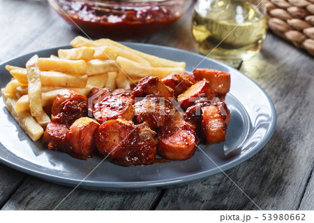 Traditional German currywurst - pieces of sausage Traditional German currywurst - pieces of sausage 53980662