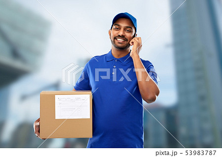 indian delivery man with smartphone and parcel box 53983787