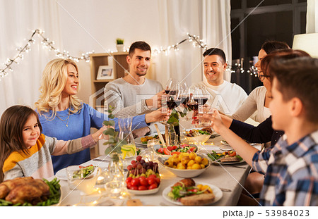 happy family having dinner party at home 53984023