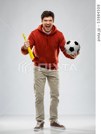 man or football fan with soccer ball and vuvuzela man or football fan with soccer ball and vuvuzela 53984509