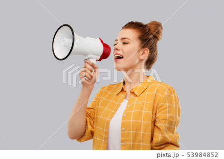 red haired teenage girl speaking to megaphone red haired teenage girl speaking to megaphone 53984852
