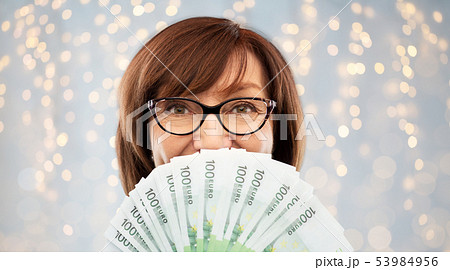 senior woman with hundreds of euro money banknotes 53984956