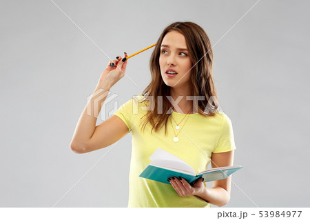 teenage student girl with diary or notebook thinks 53984977