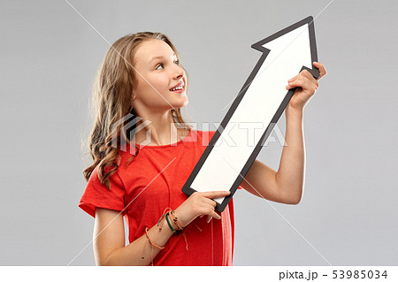 teenage girl with arrow shows north east direction 53985034